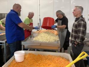 Mayor Siemens watched volunteers at work at the Fraser Valley Gleaners.